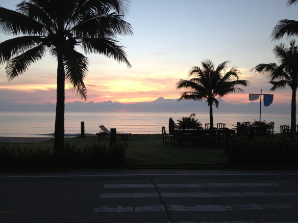 The sun begins to light up the eastern sky over the Gulf....