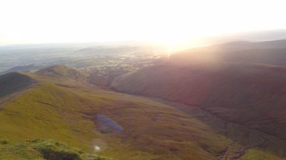 Looking down from the summit of Pen Y Fan just after sunrise 