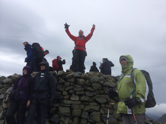 Summit of Scafell Pike (excuse the slightly over the top celebration!), Peter, Margaret and Sener in foreground.