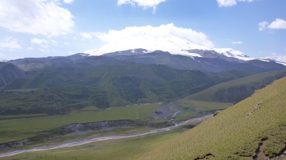Base camp comes into view at 2,500m on Elbrus - that river down there is also the road however....