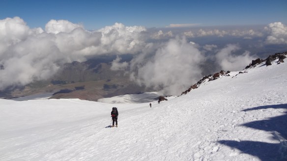 Looking down towards High Camp from Lenz Rocks at 4,800m, the clouds now starting to roll in up the mountains