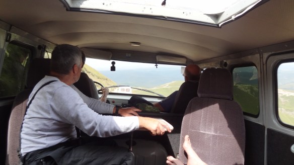 On the dirt road out of Base Camp - even Viktor had to hold onto something!