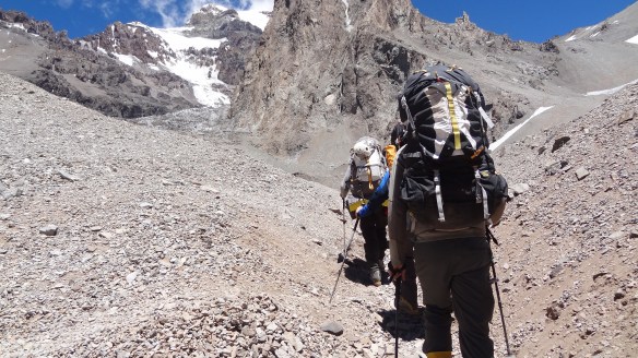 Still with fairly heavy loads, we head up the steep slopes to our destination just out of picture top right.