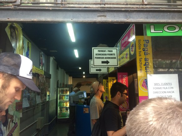 Lining up at a kiosk in downtown Mendoza for our Aconcagua passes - bizarre!