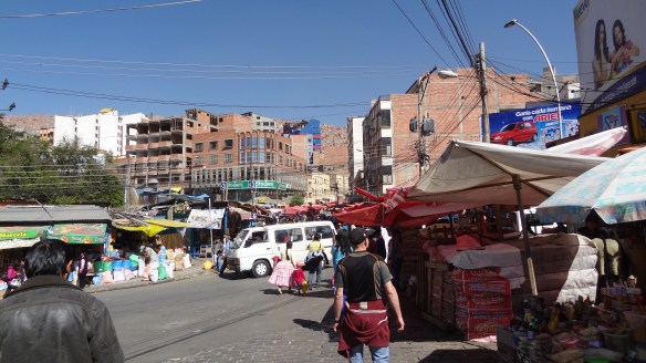 A typical La Paz street market. Note in the background how steeply the houses rise into the hillside.