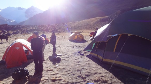 The camp is in a bowl and is flanked by 5,000m peaks and so the sun takes a while to reach it and warm us up a bit.