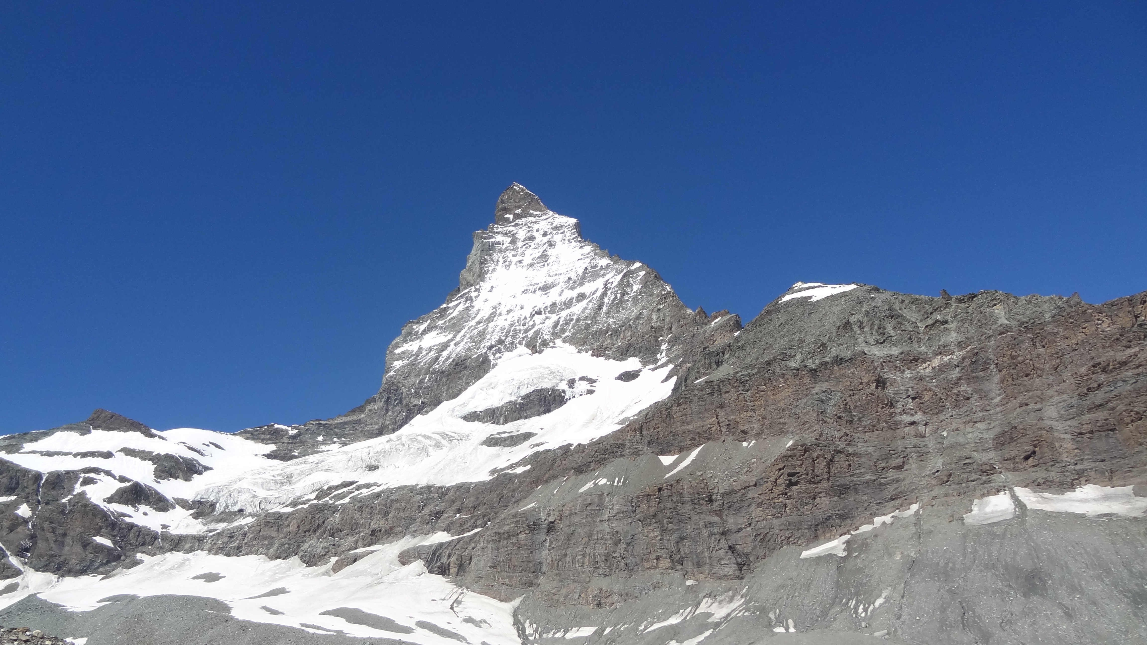 Approaching the Matterhorn - the Hornlihutte is on the tip of snow at about 3pm on the picture.